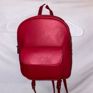 Red faux leather mini backpack